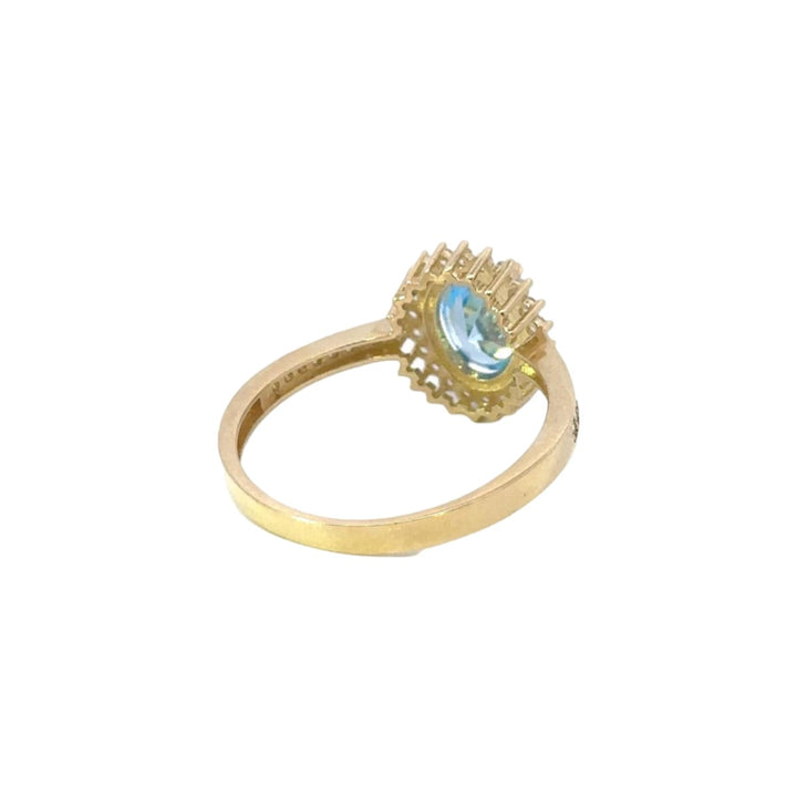 Blue Stone Ring Surrounded by Cubic Zirconia in 14K Gold - Dia Jewelry Store