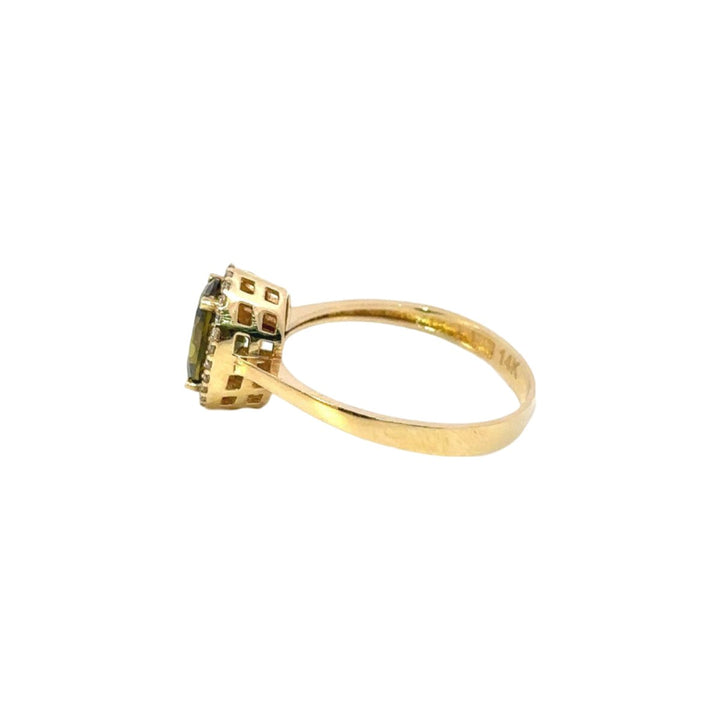 Light Green Ring Surrounded by Cubic Zirconia in 14K Gold - Dia Jewelry Store